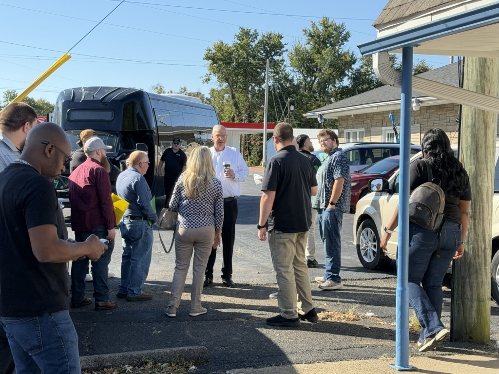 PCG Executive Focus Group members gathering during a pawnshop store tour in Evansville, Indiana.