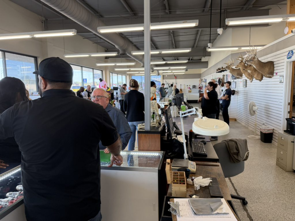 PCG Executive Focus Group members reviewing pawnshop operations during the October 2026 Evansville store tour.