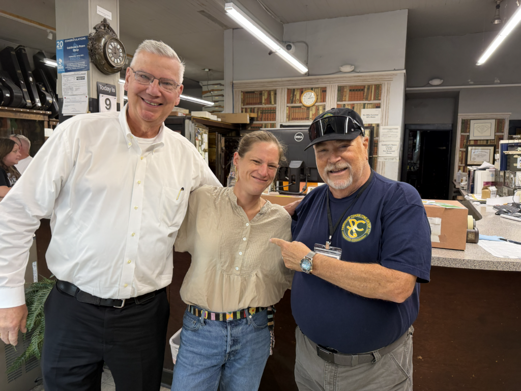 Rachael Goldman with Jerry Whitehead and Mark Daily during the PCG Executive Focus Group visit to Goldman’s Pawn Shop in Evansville.